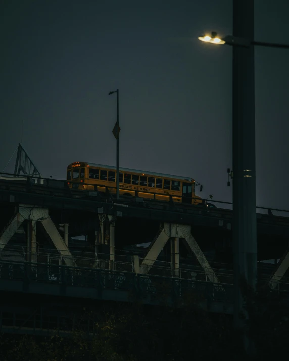 bus on train track under lit street light