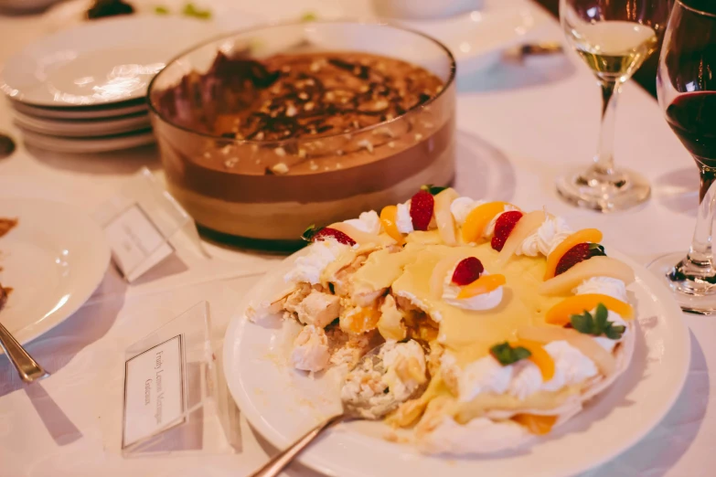 a table with many plates and glasses of wine