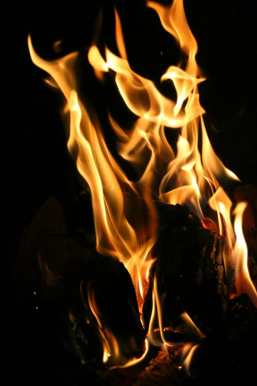 a group of fire flames with black background