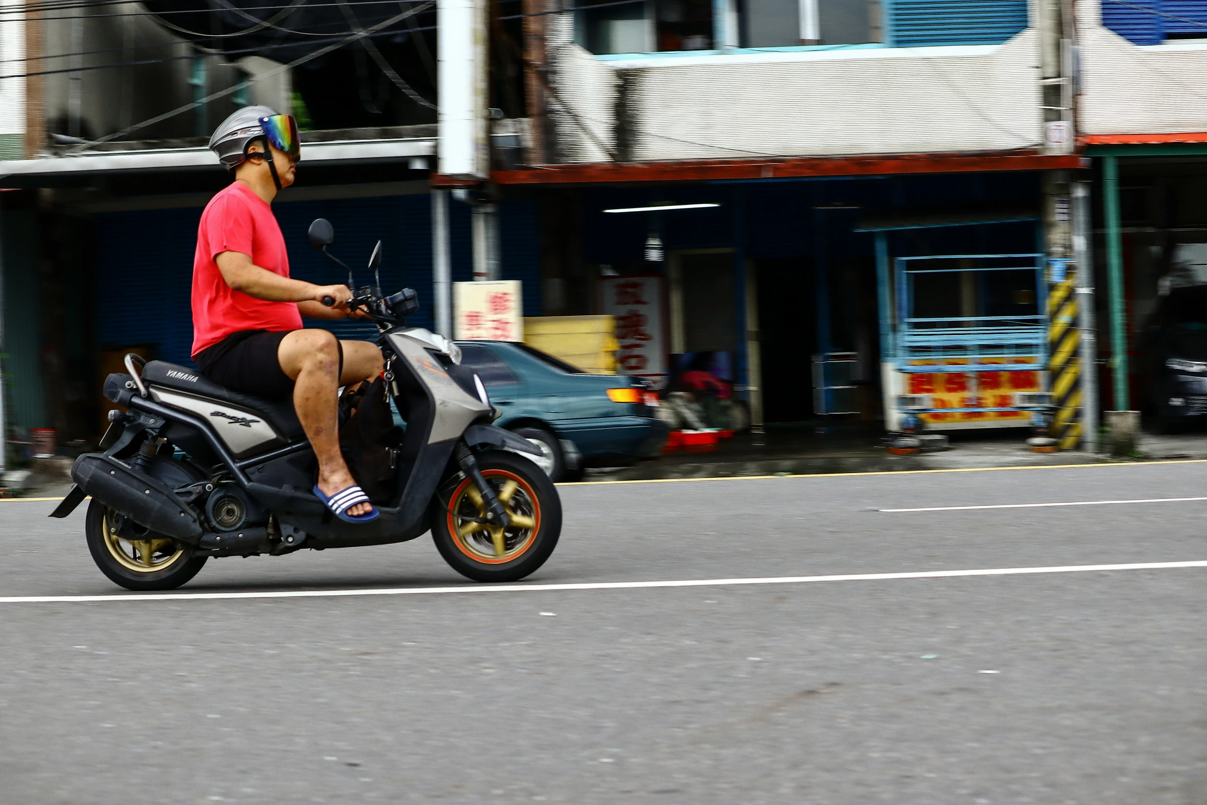 a man riding a motorcycle on the road