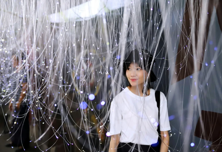 woman standing in front of bubbles of water