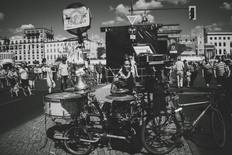 there are people standing and playing music in the street