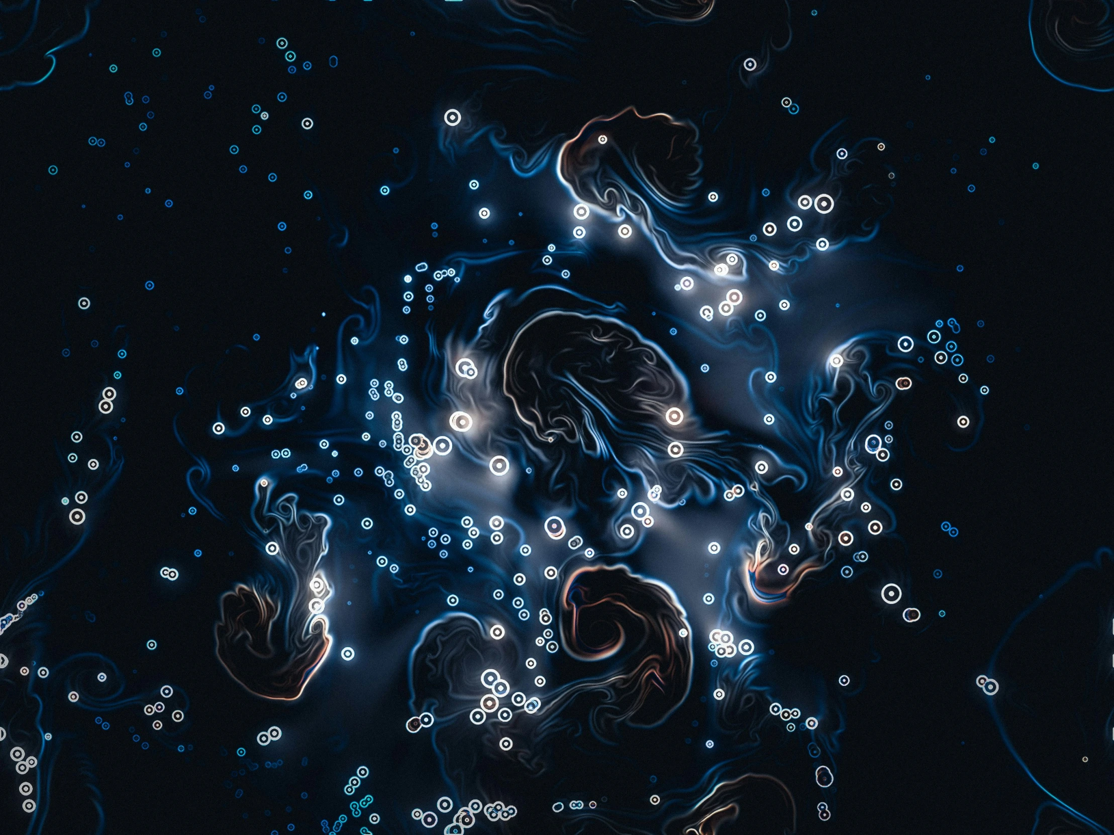 water in the dark with bubbles on it