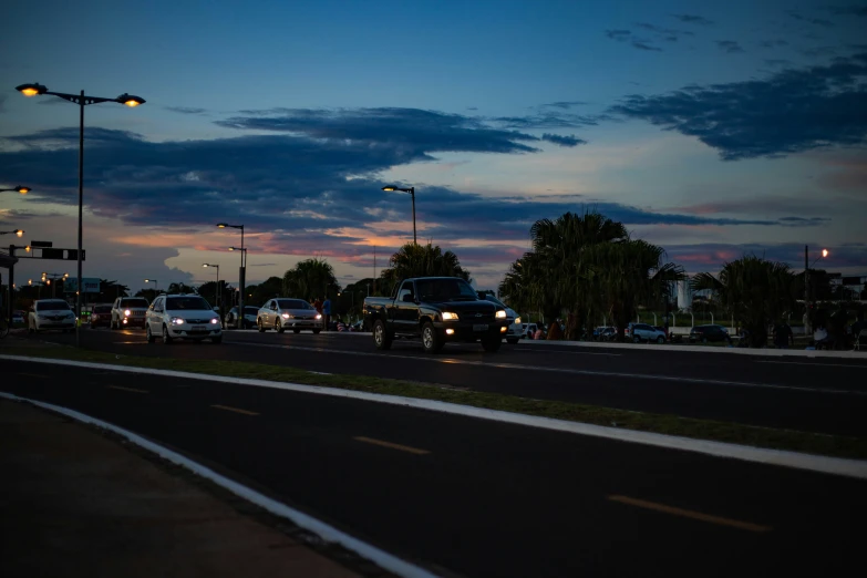 a group of cars traveling down a busy street