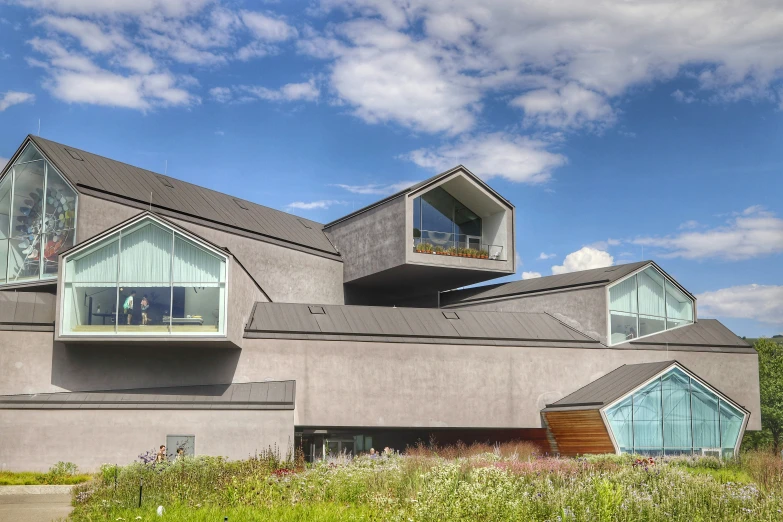 a very unusual looking building on a hill