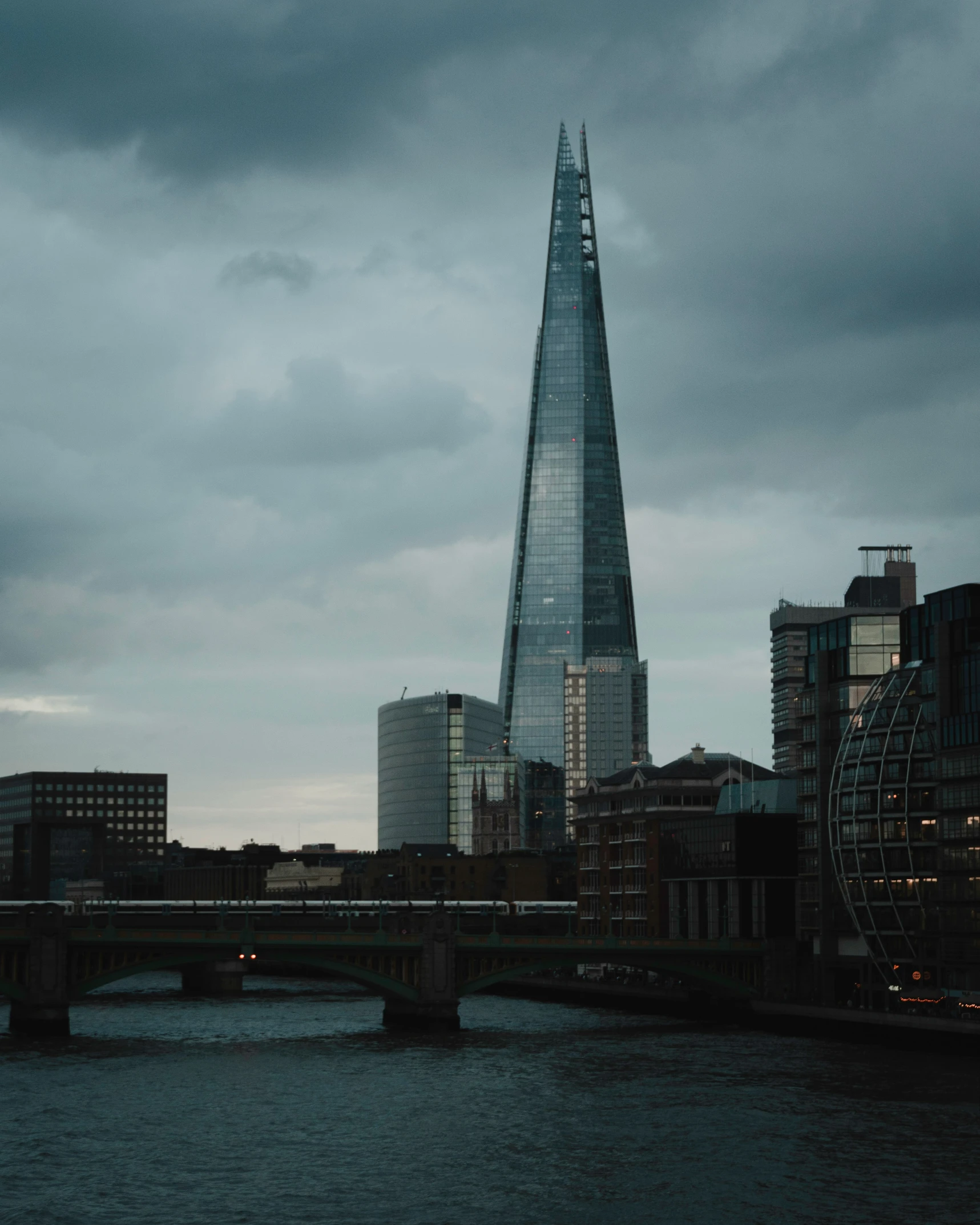 a long exposure s of a bridge with the shard tower in the background