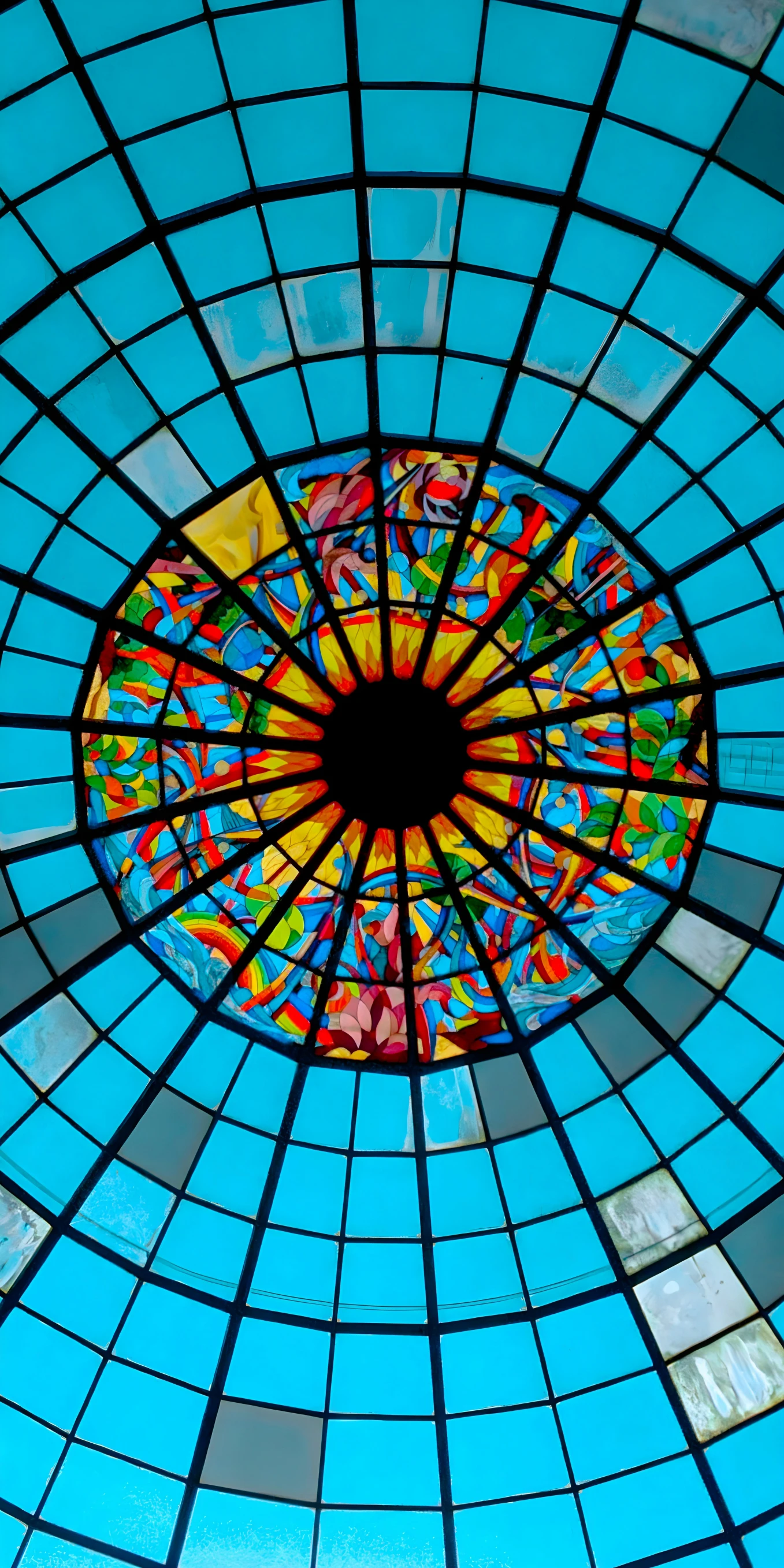 an artistic image showing a stained glass ceiling