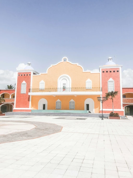 a big building that has a big square in front of it