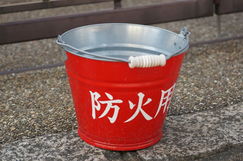 an empty bucket with a white cord in it