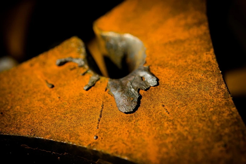 a small metal object laying on top of a wooden table
