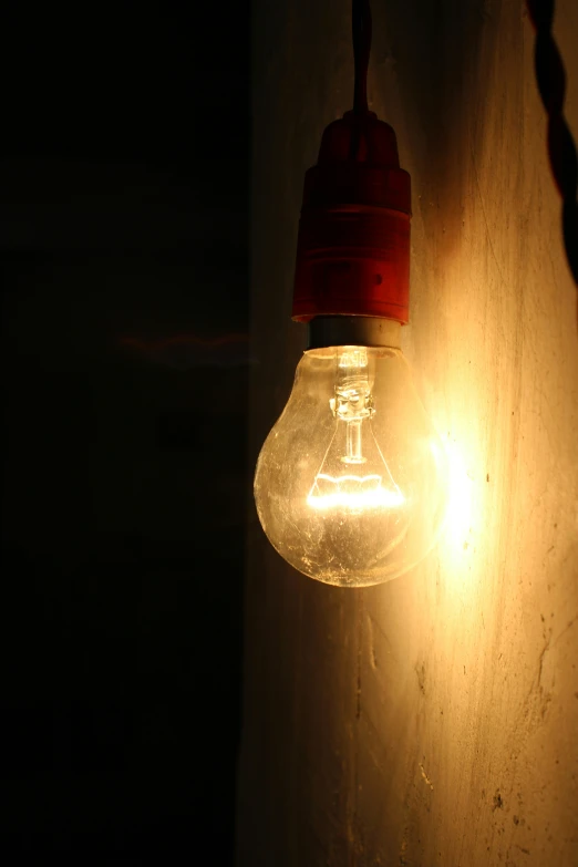an light bulb is glowing brightly on a dark background