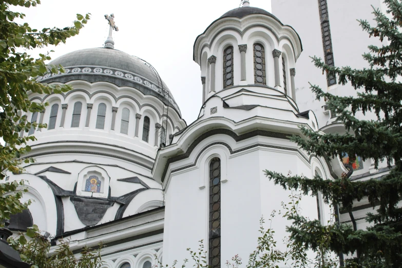 a church is shown from outside with two towers