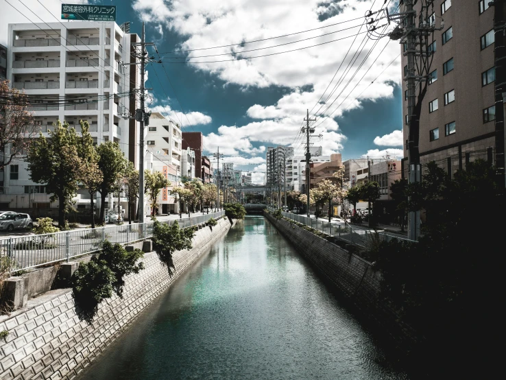 the river runs through a small town with lots of buildings