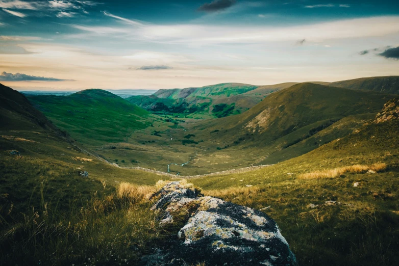 a rocky slope is seen on the side of a hill