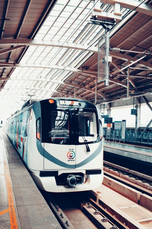 a train sits at a station with no passengers