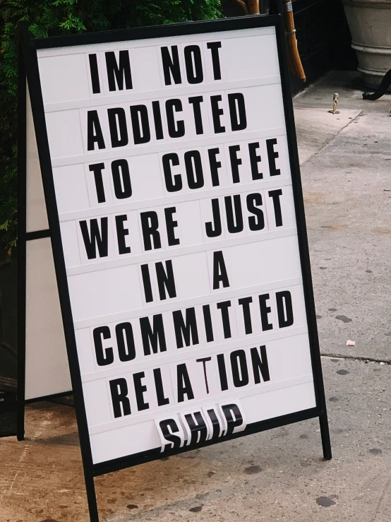 a sign with some words that reads i'm not attracted to coffee we're just in a committee relaxation space