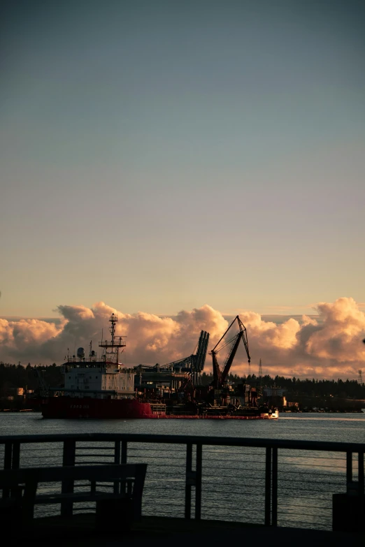 a cargo boat is parked next to a harbor