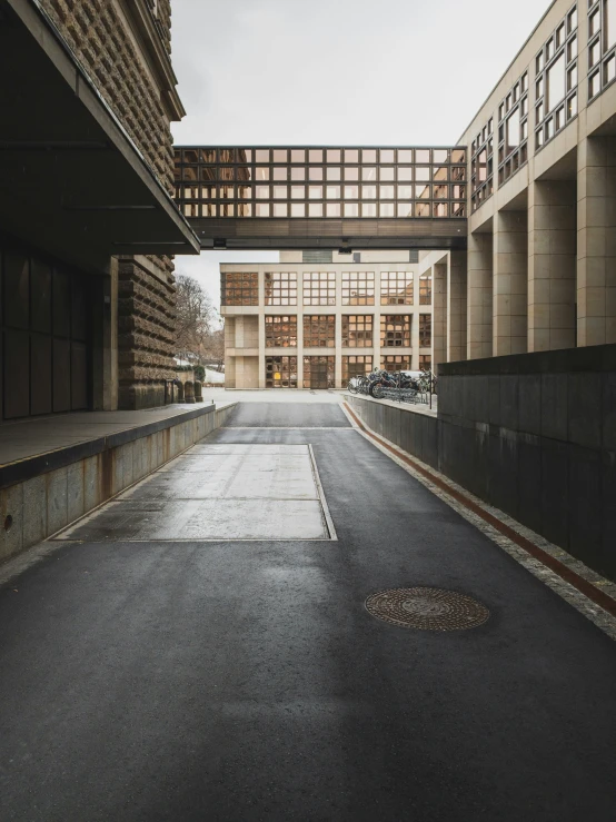 an empty building and sidewalk with no cars on it