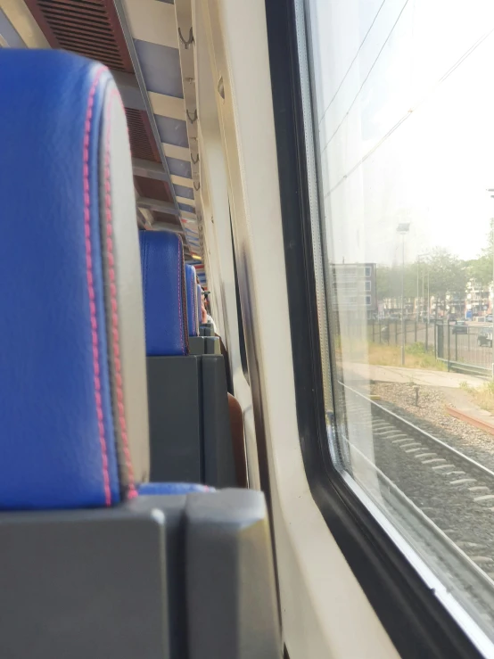 an empty train car next to some other rail road tracks