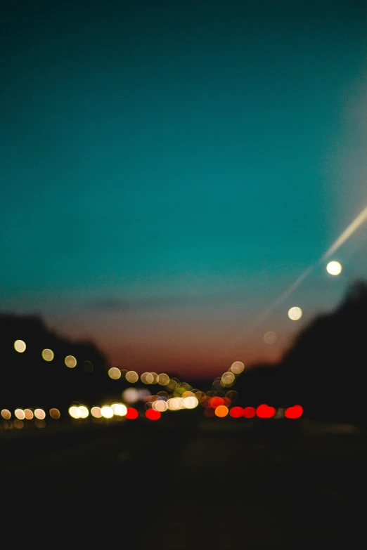 an image of blurred city lights at dusk