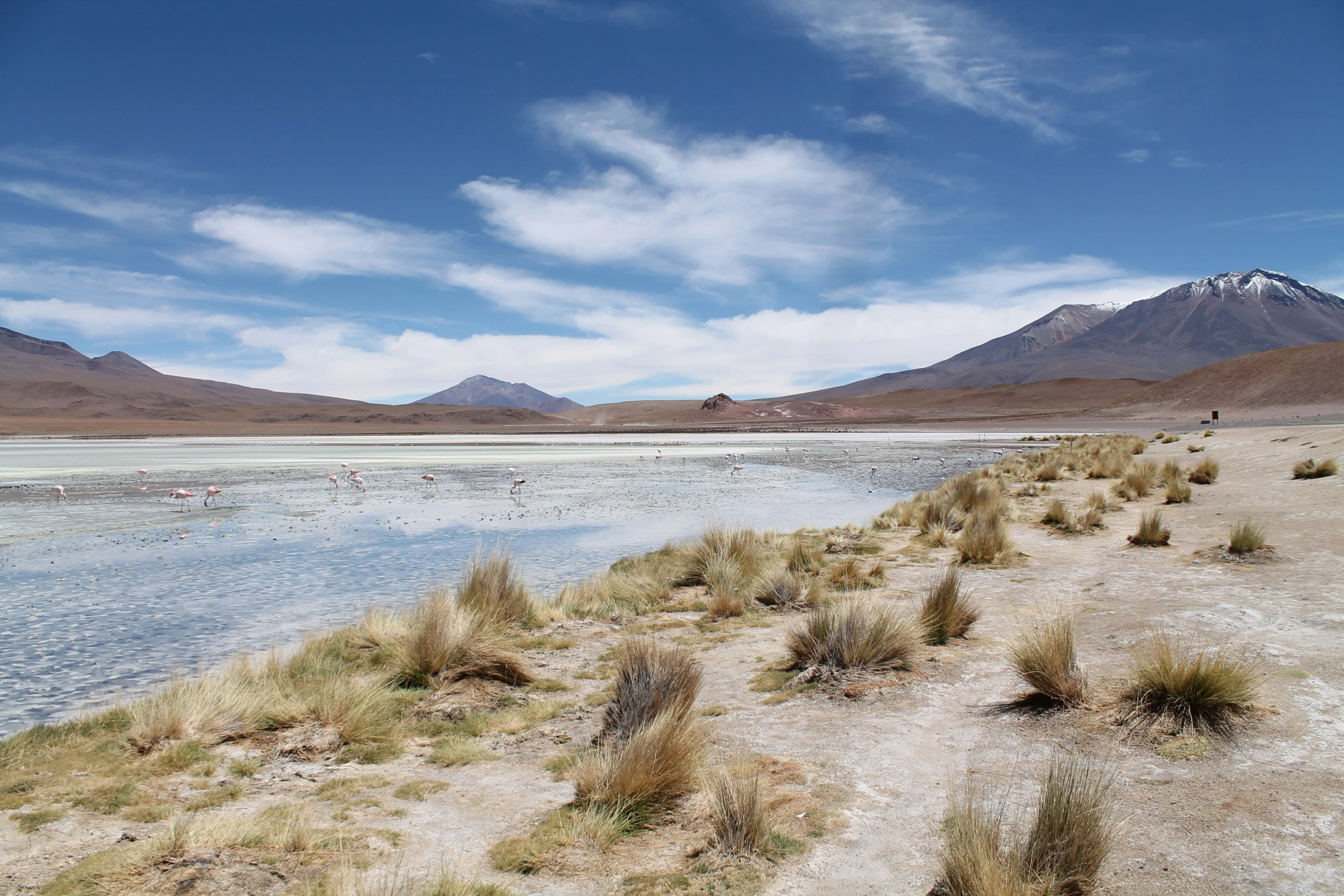 a very wide body of water surrounded by hills