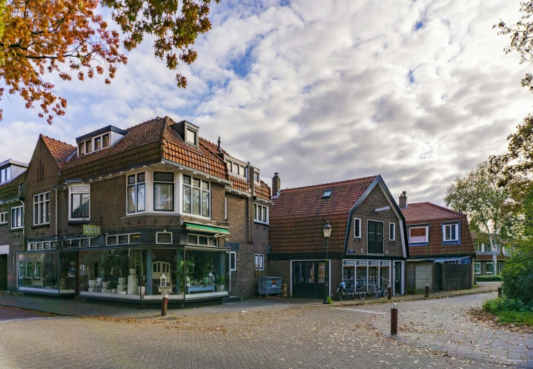 an old brick storefront on the corner of a street