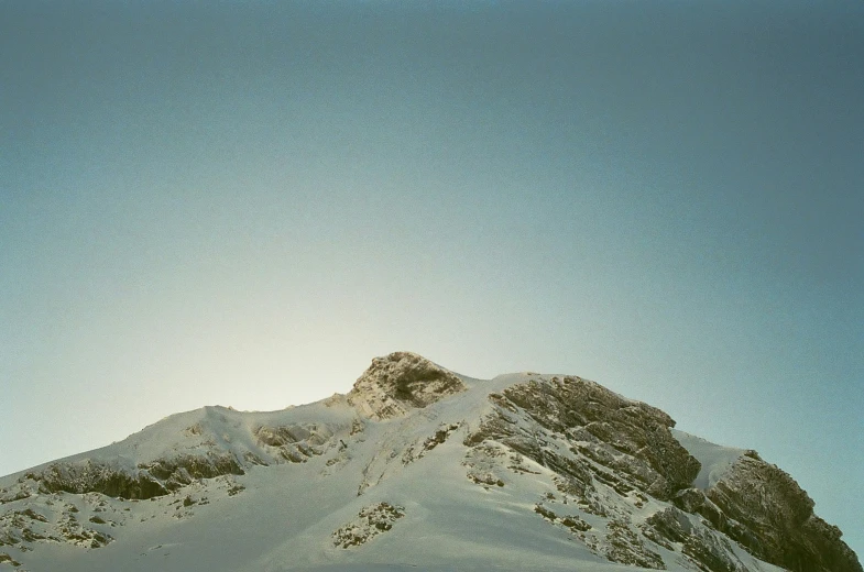 a person skiing on snow covered mountains in the winter