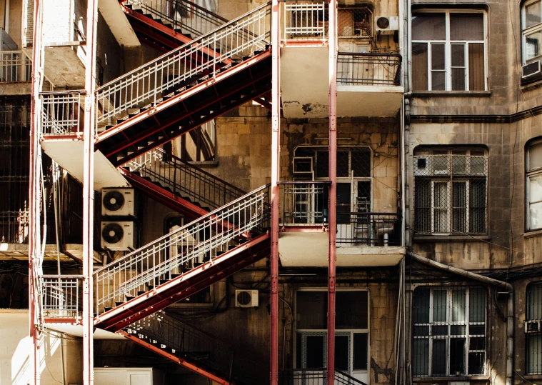 a large fire escape is shown in front of buildings