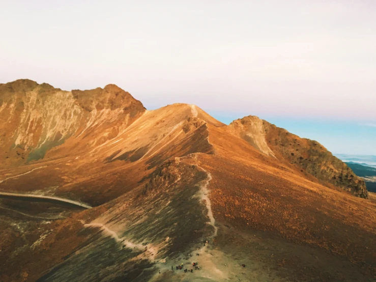 the view of a brown mountain range is very scenic