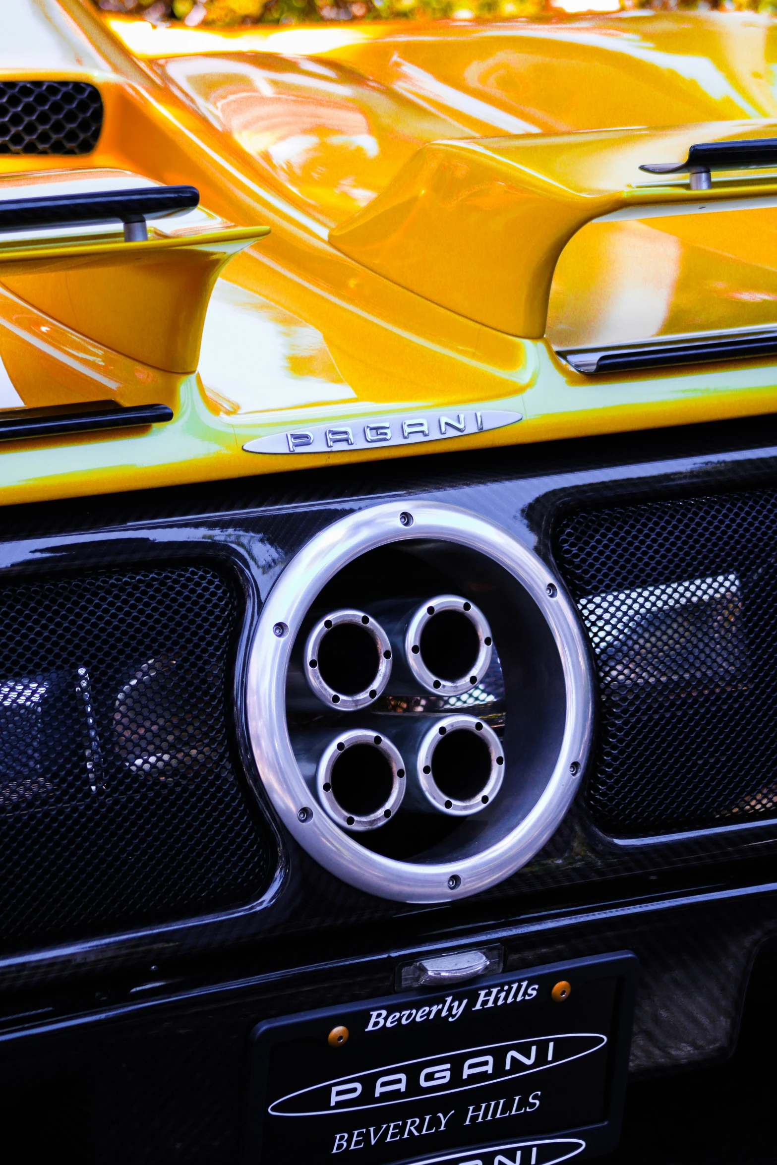 the front end of an electric car with its bright paint job