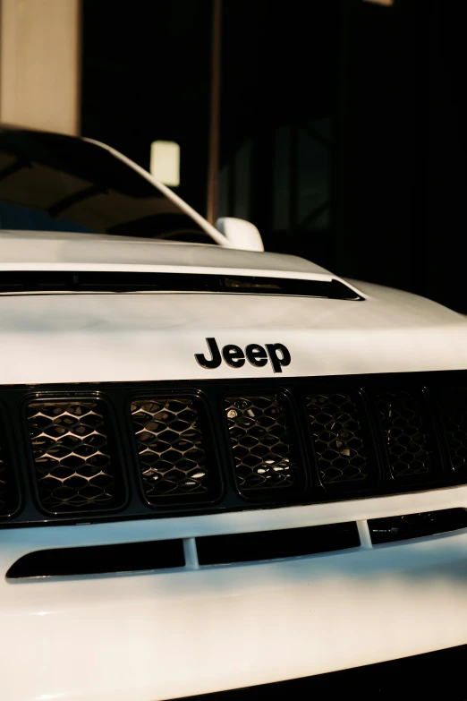 an automobile front end with the jeep logo