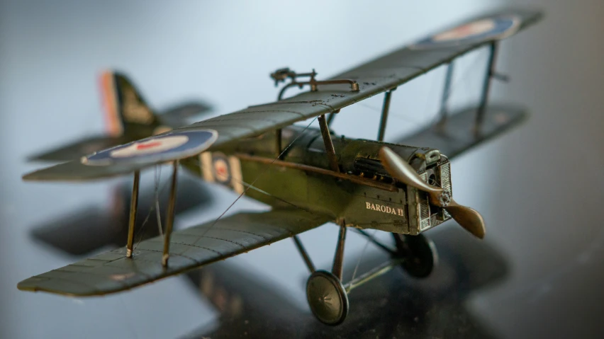 a single prop airplane that is on a table