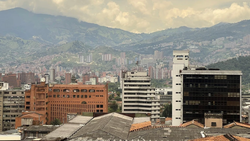 a view of a city with hills in the distance