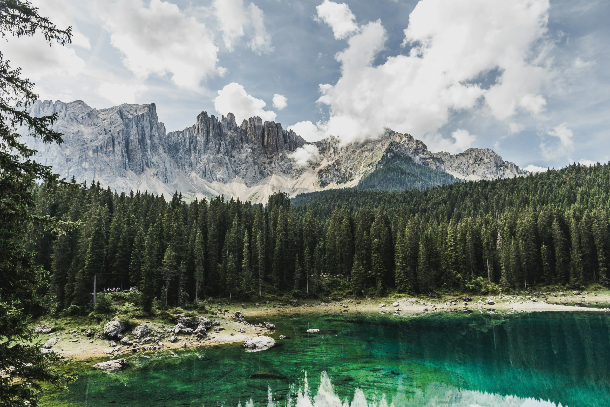 a lake that is surrounded by mountains with some water