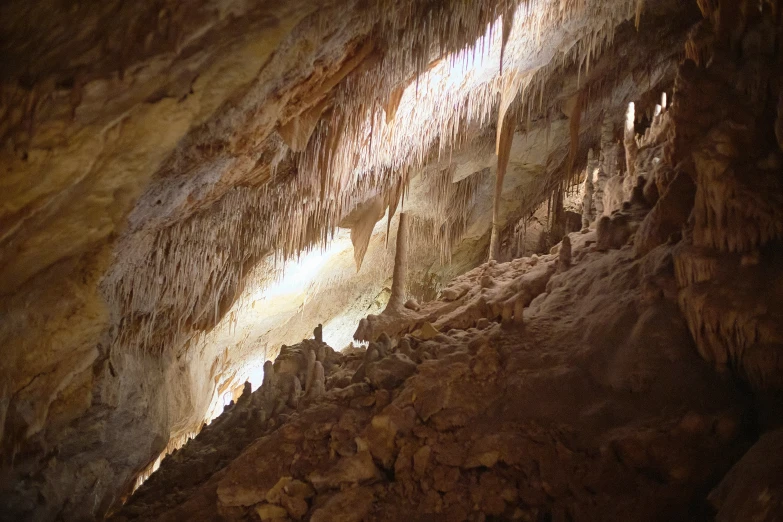 inside view of large cave with very long formations