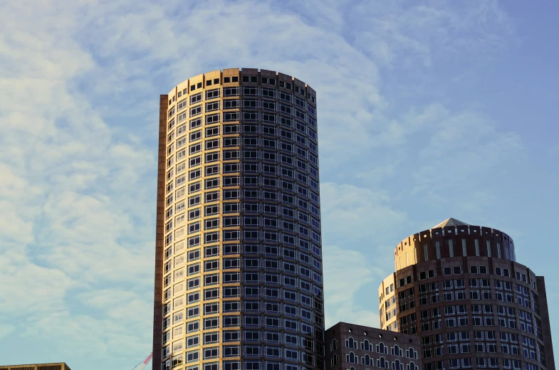 two very tall buildings in the afternoon