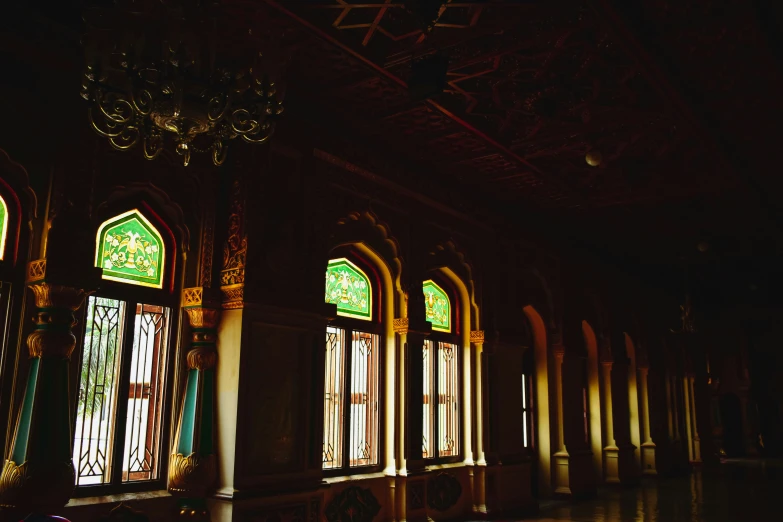 sunlight streams through the stained glass windows of a building