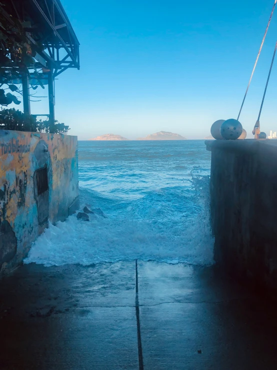 a small dock with water coming out of the side