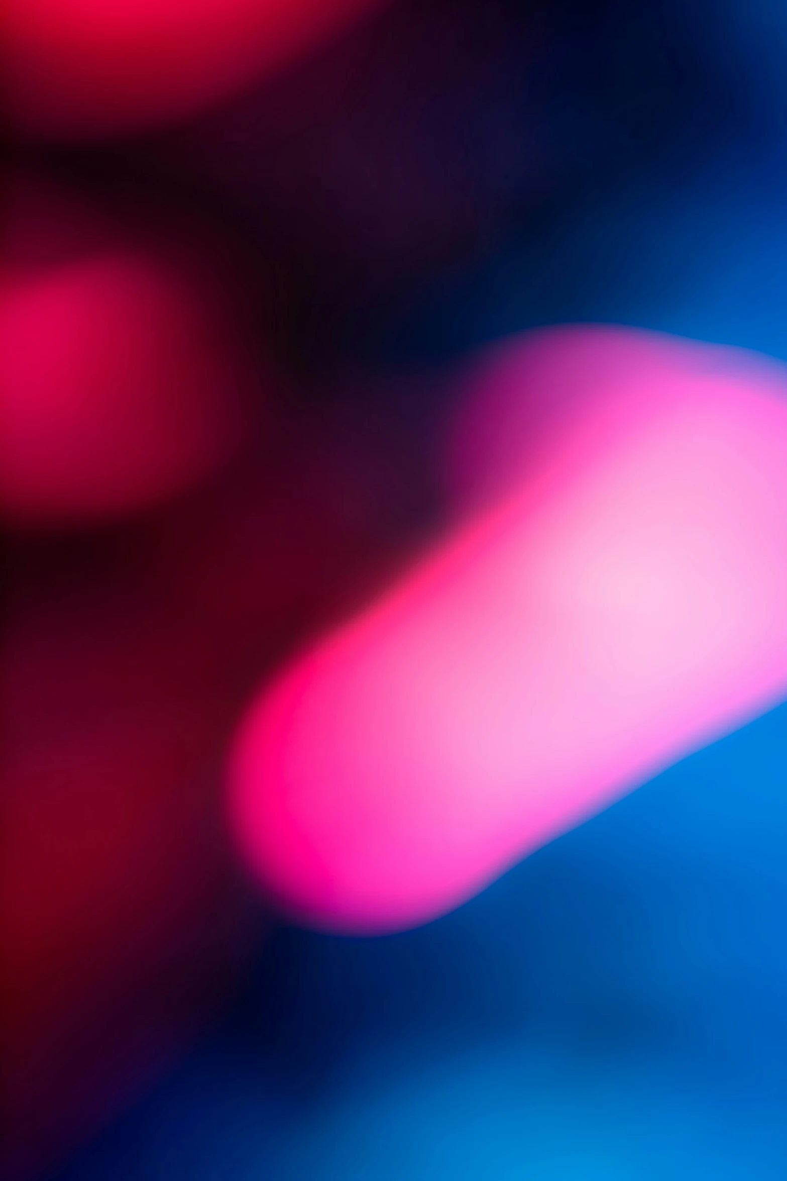 a blurry blue pink background has bright red lights