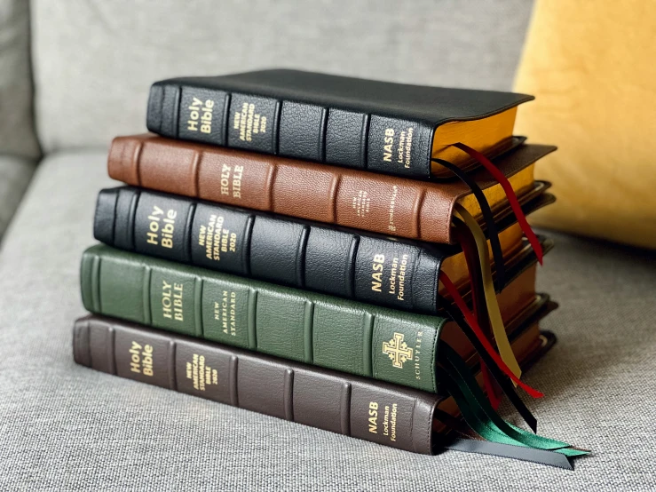 a set of three books with one being folded to look like a plane