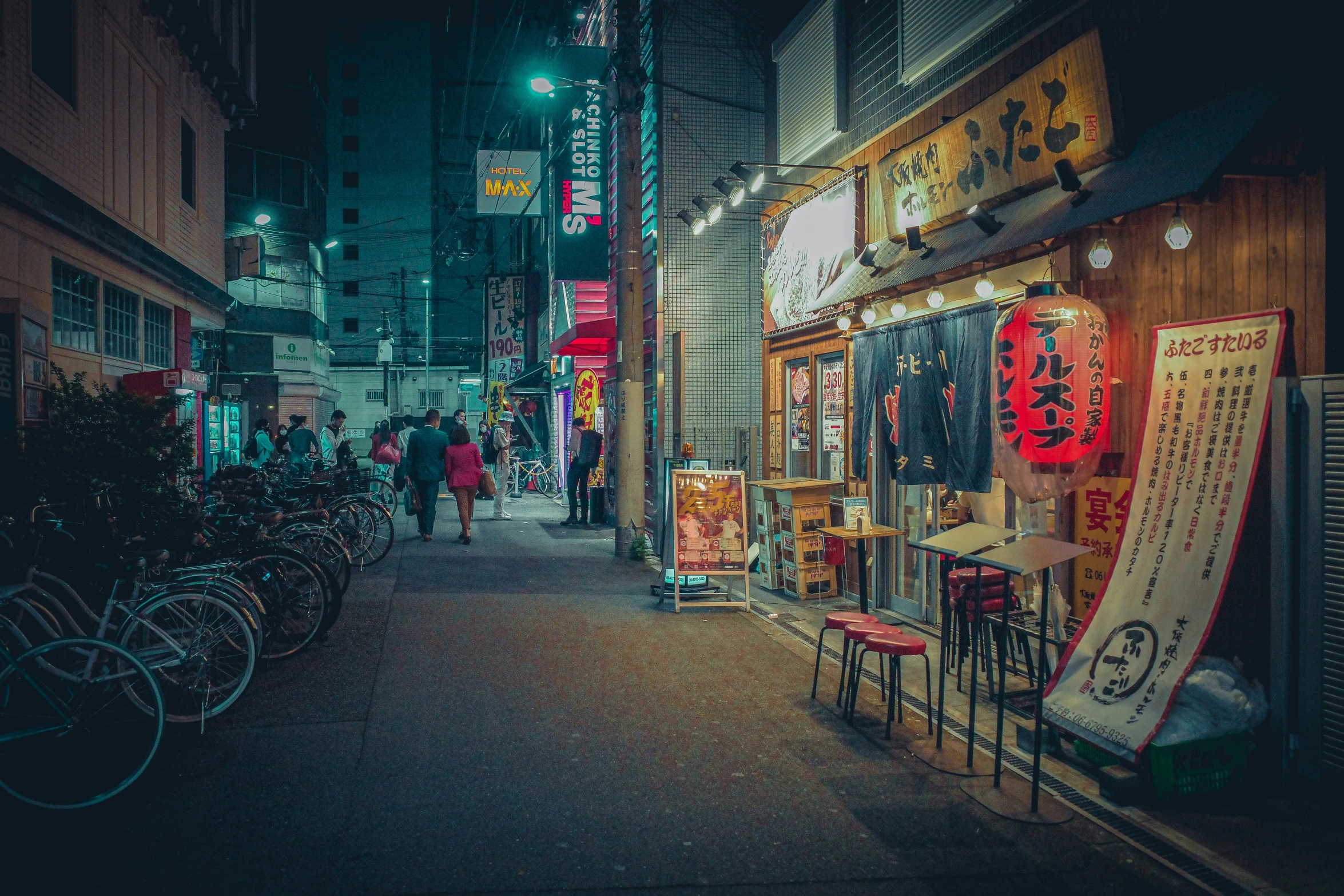 street scene showing a city scene at night