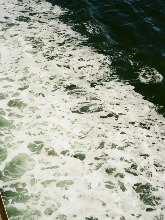water rushing toward the shore from a boat