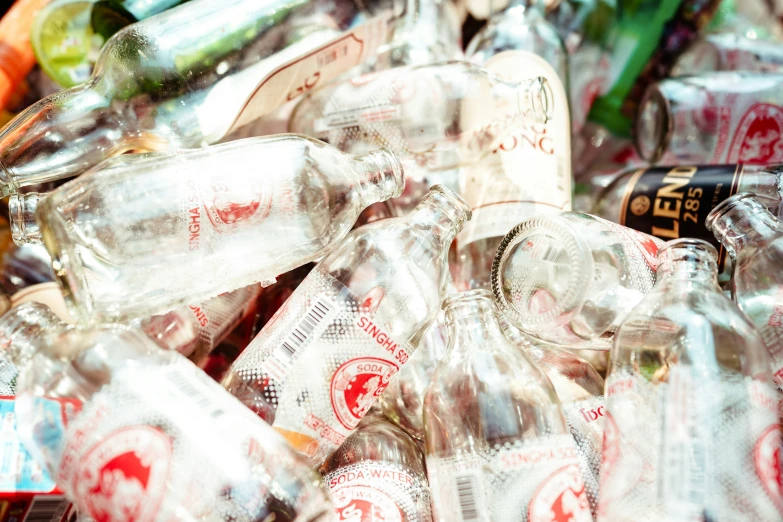 a pile of empty plastic bottles of different colors