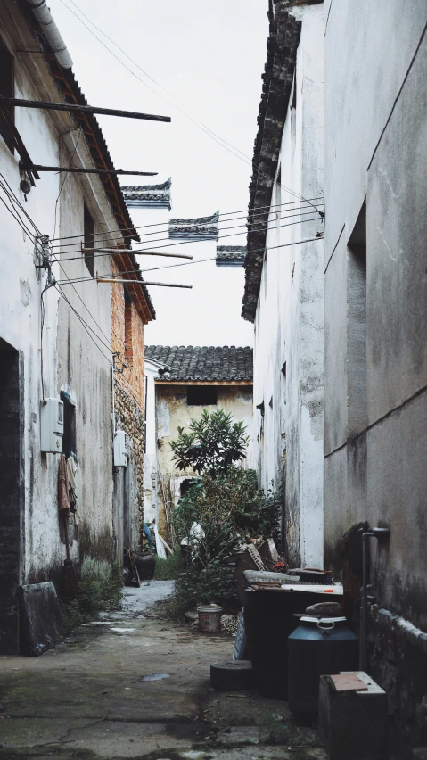 a street lined with old building next to a courtyard