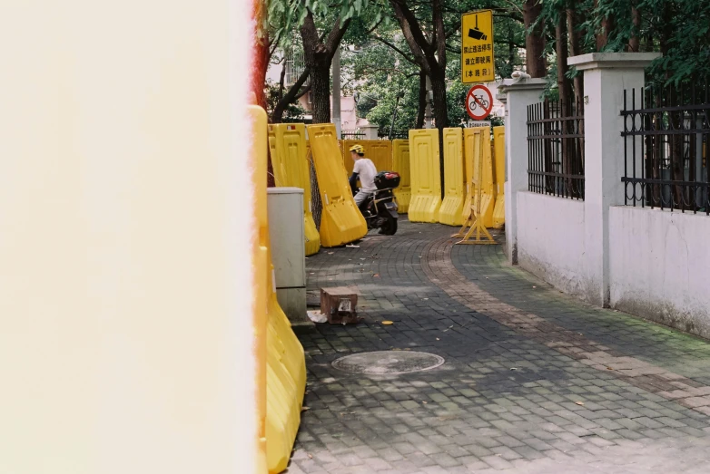 some construction workers are fixing the concrete barricades