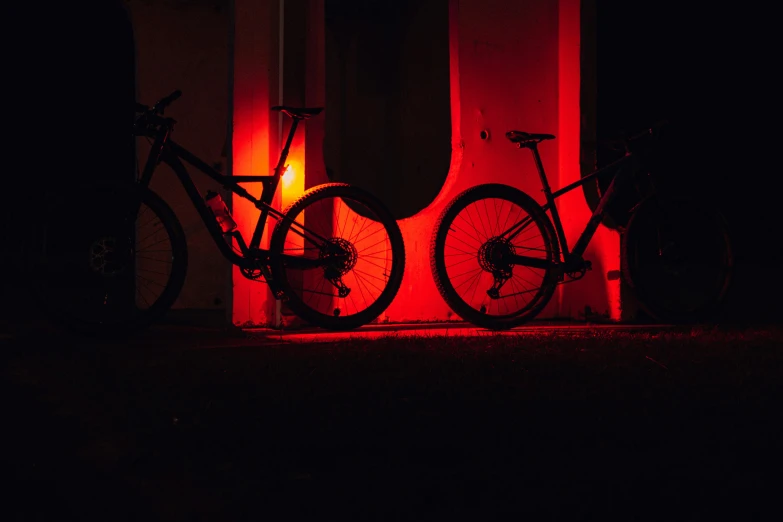 a bicycle is lit up by two red lights