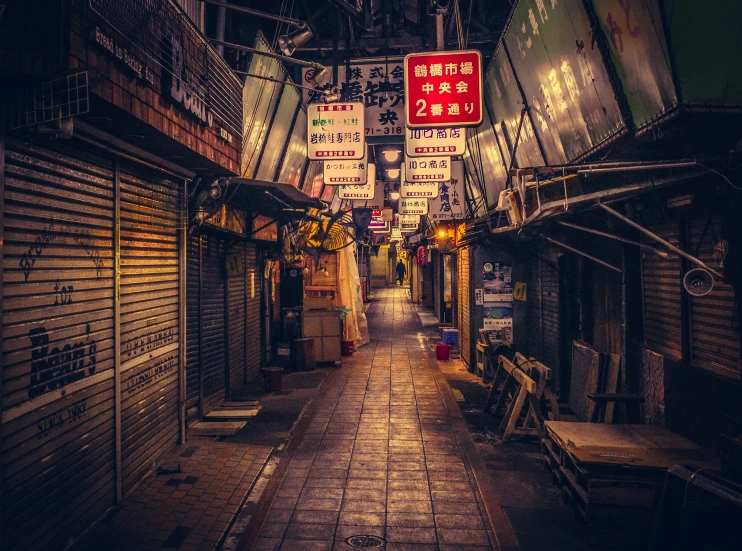 a narrow walkway in a shopping mall area