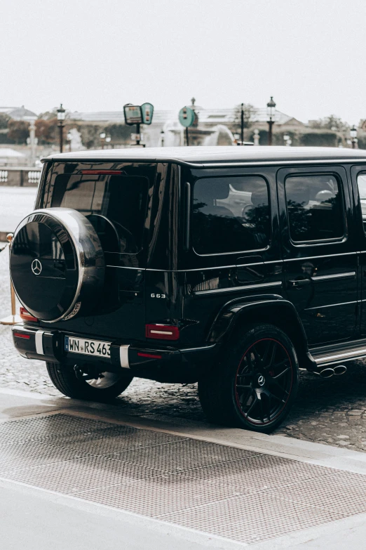 a black jeep parked on the side of a snowy road