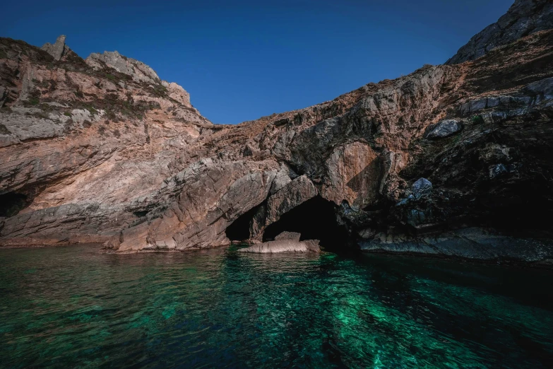 cliffs are seen from the water of the sea