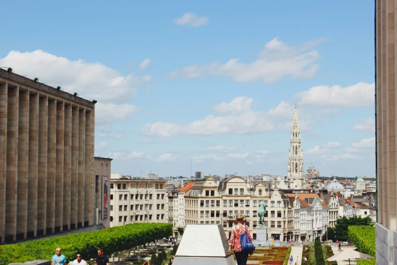 some people are standing on the top of a high rise